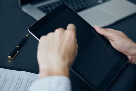 Businessman, businessman working on a tablet, businessman with a tablet.