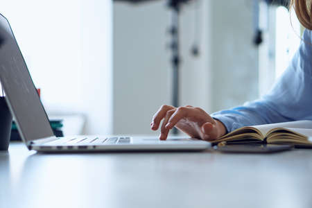 Business woman working, business woman types on laptop, notebook.の写真素材