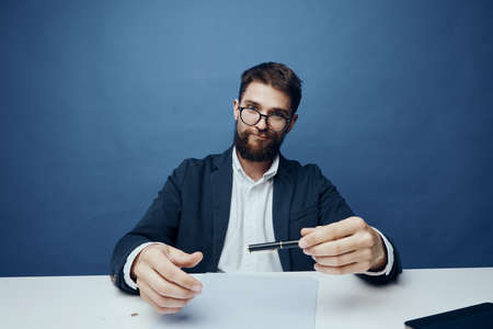 Business man with pen, businessman working in office, businessman on blue background.の写真素材