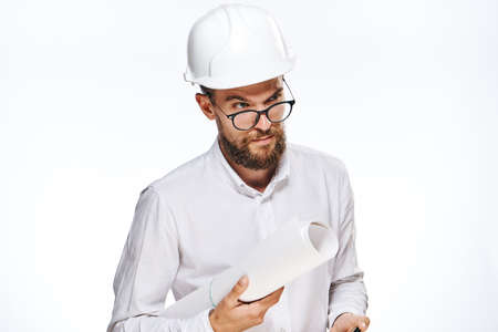 Business man with glasses, businessman in hard hat, businessman with blueprint on isolated background.の写真素材