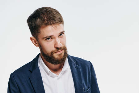 Businessman, businessman with a beard, businessman on a light background.の写真素材