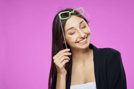 Girl on a pink background, paper accessories, party accessories, party, holiday.の写真素材