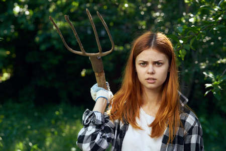 Pitchfork, dacha, season, work in the garden, garden, flowers, girl at the dacha, gardener.の写真素材