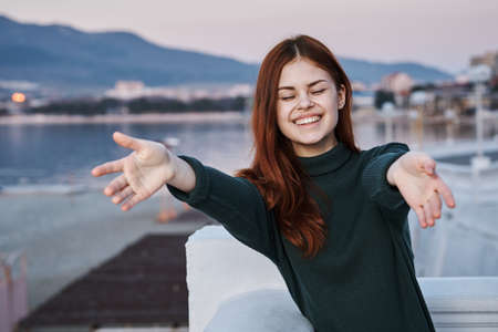Emotions, smile, girl smiling, girl in the street, red-haired woman.の写真素材