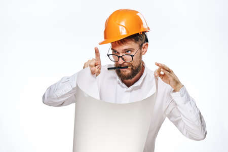 Engineer on white isolated background, builder in hard hat and glasses.の写真素材