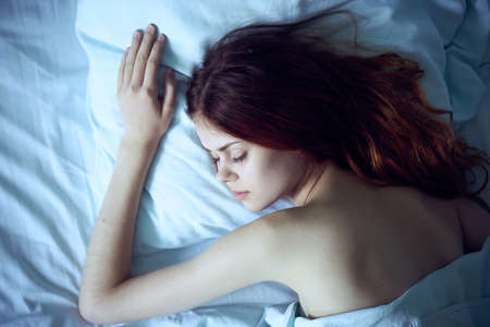 Woman sleeping, woman in bed, rest, sleep, morning.の写真素材