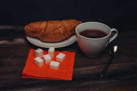 Tea mug, croissants, sweets, delicious, sugar, spoon, napkin.の写真素材