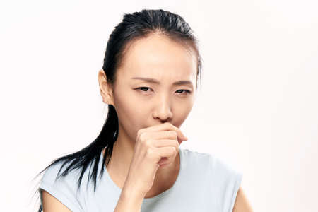 Asian, disease, health, woman on white isolated background.の写真素材