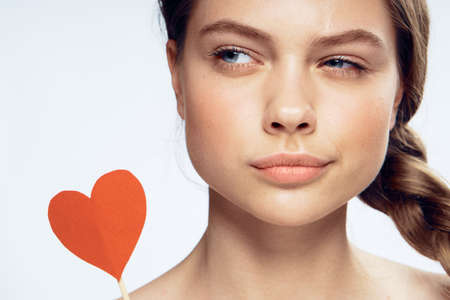 Emotions, portrait, woman on white isolated background, paper accessories for parties and celebrations.の写真素材