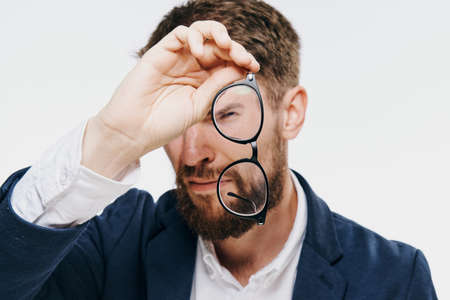 Businessman, businessman with glasses, businessman on a light background portrait.の写真素材