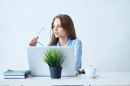 Business woman lost in thought, woman working in the office, business woman.