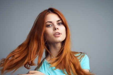 Woman background, woman with flowing hair, woman on gray background.の写真素材