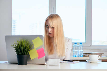 Business woman, woman working, woman looking into laptop.の写真素材