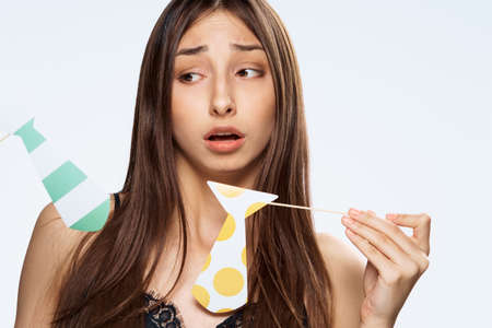 Paper accessories for parties and celebrations, emotions, woman on white isolated background.の写真素材