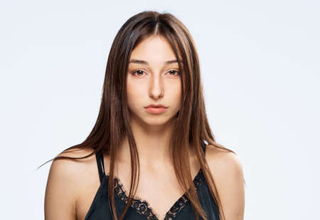 Portrait, young woman on white isolated background, brunette, natural beauty.の写真素材