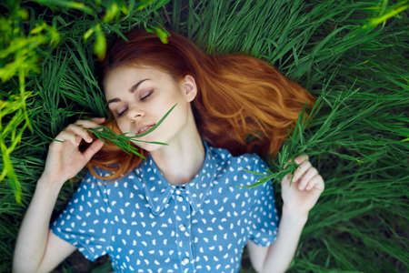 Summer, emotions, woman in grass, season, happiness, fun, colors, plants, tenderness.の写真素材