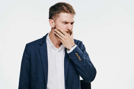 Businessman with a beard on white isolated background, emotions, portrait.の写真素材