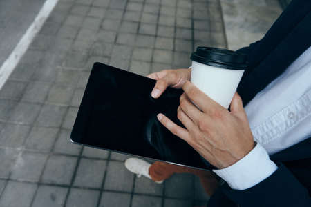 Office, work, business man on a city street, coffee break.の写真素材