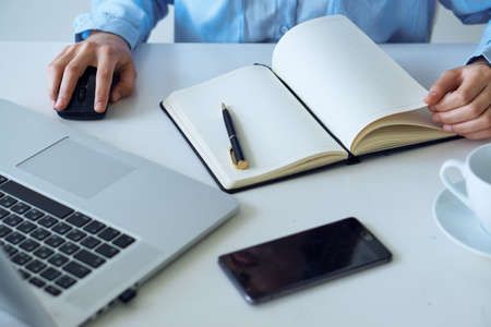 Working desk, woman at the computer in the office working.の写真素材