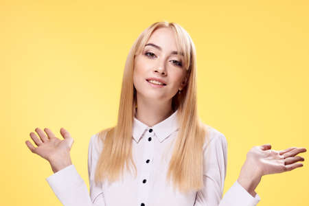 Businesswoman, woman on yellow background, emotions, office, blonde.の写真素材