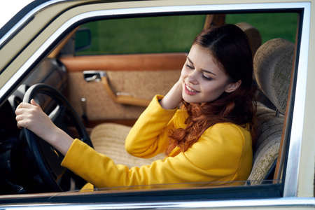 Beautiful young woman behind the wheel in the car, fashion, beauty.の写真素材