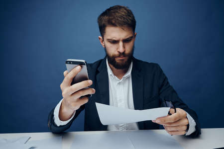 Business man with a beard at his desk in the office.