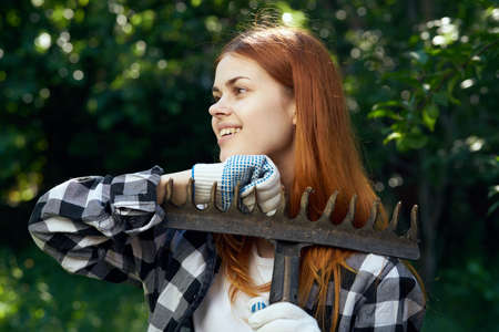 Young woman working in the garden, gardener.の写真素材