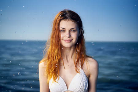 Young beautiful woman on vacation at sea, ocean, water, summer.