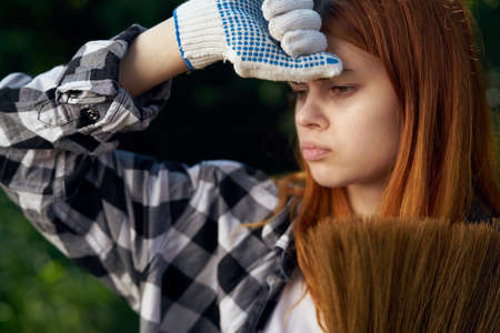 Beautiful young woman running in the garden, gardener.の写真素材