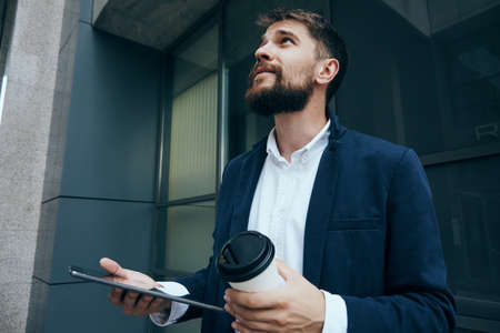 Business man with a beard on a break outdoors in the city.の写真素材