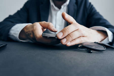 Business man with a beard working at his desk in the office.の写真素材