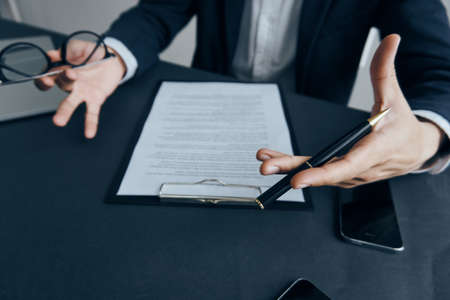 Hands, business, office, documents, tablet, phone, laptop, computer, money.の写真素材