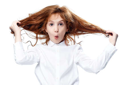 Child on white isolated background, portrait, emotions.の写真素材