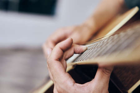 Guitar, musical instruments, sheet music, mediator, strings.の写真素材