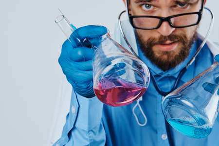 Scientist with a beard on a blue backgroundの写真素材