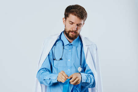 Doctor putting on gloves