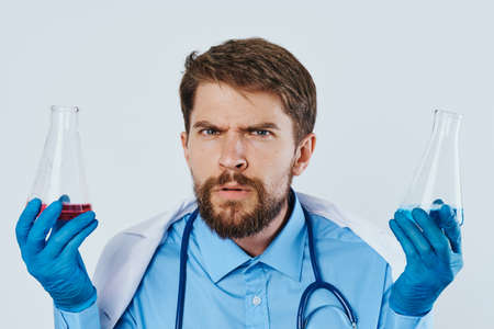 Young guy with a beard on a white isolated background, medicine, science, doctor, scientist.の写真素材