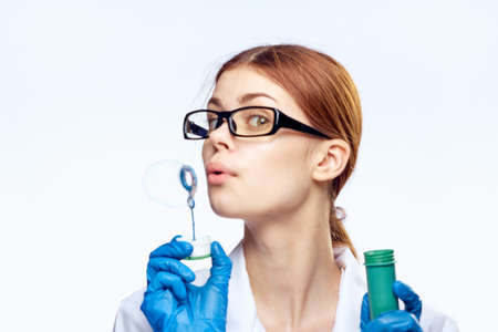 Young beautiful woman on white isolated background, doctor, scientist, medicine.