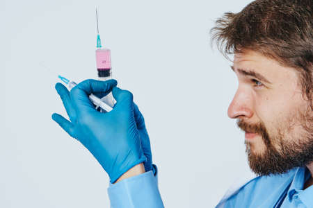 Man with a beard against a light background, doctor, medicine, scientist, science.の写真素材