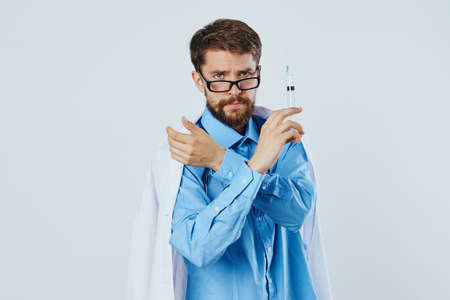 Man with a beard against a light background, doctor, medicine, scientist, science.