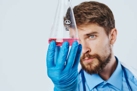 Man with a beard against a light background, doctor, medicine, scientist, science.の写真素材