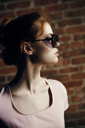 Beautiful young woman walking outdoors in city in summer.の写真素材