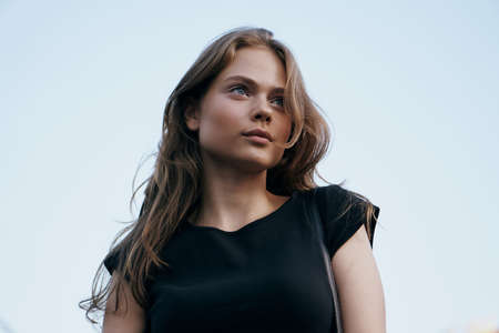 Beautiful young woman walking in summer outdoors in the city, fashion, style.の写真素材