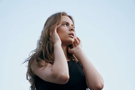 Young beautiful woman outdoors in the city, portrait.の写真素材