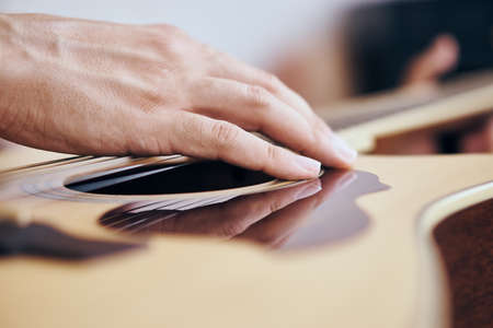 Hand of a guitarist, close-up guitar, chords, strings.の写真素材