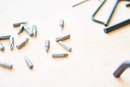 Screws, nuts, tools, drawing paper, builder's workplace.の写真素材