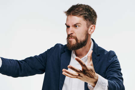 Business man with beard on white isolated background, portrait, emotion.の写真素材