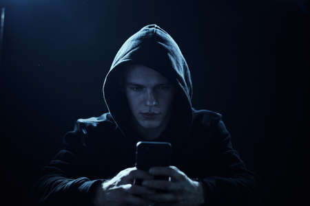 Man sitting at the computer, hacker, hacking, program, programmer, programming.の写真素材