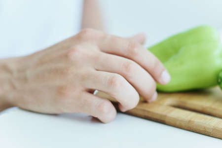 Vegetable, pepper on a cutting board closeup.の写真素材