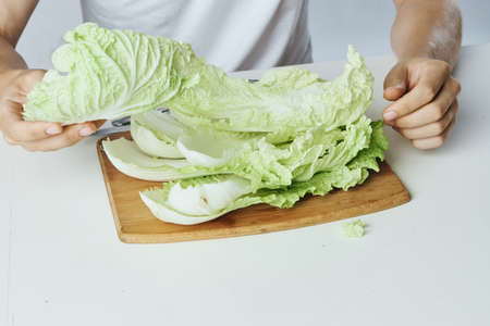 Cabbage leaves on a cutting board, vegetable diet.の写真素材